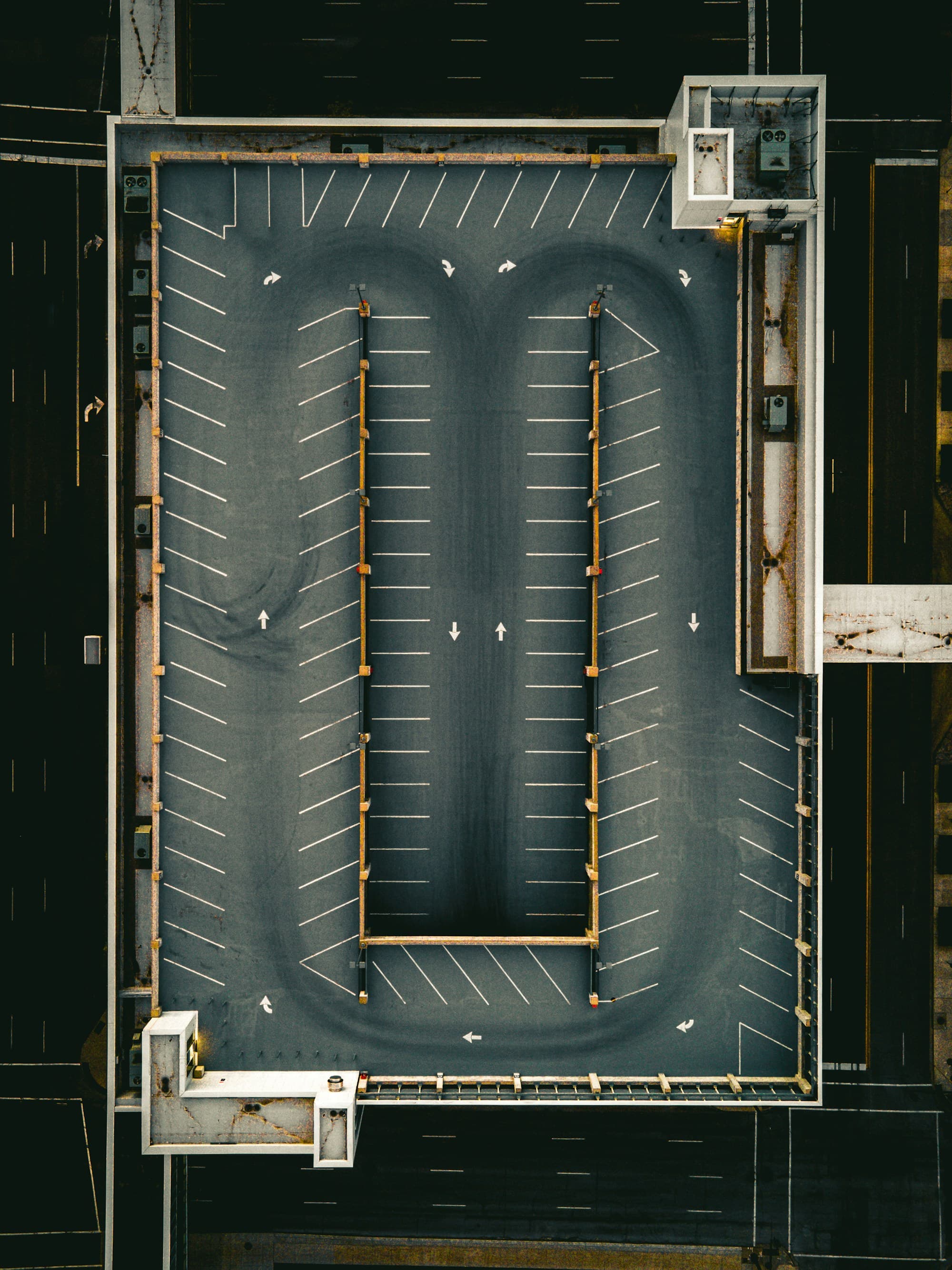 Freshly striped commercial parking lot viewed from above